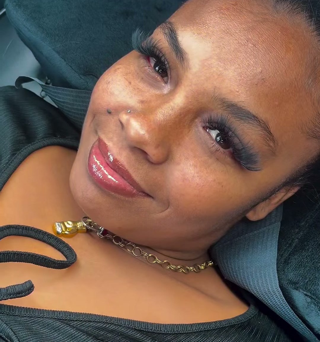 The same client after her lash set, smiling